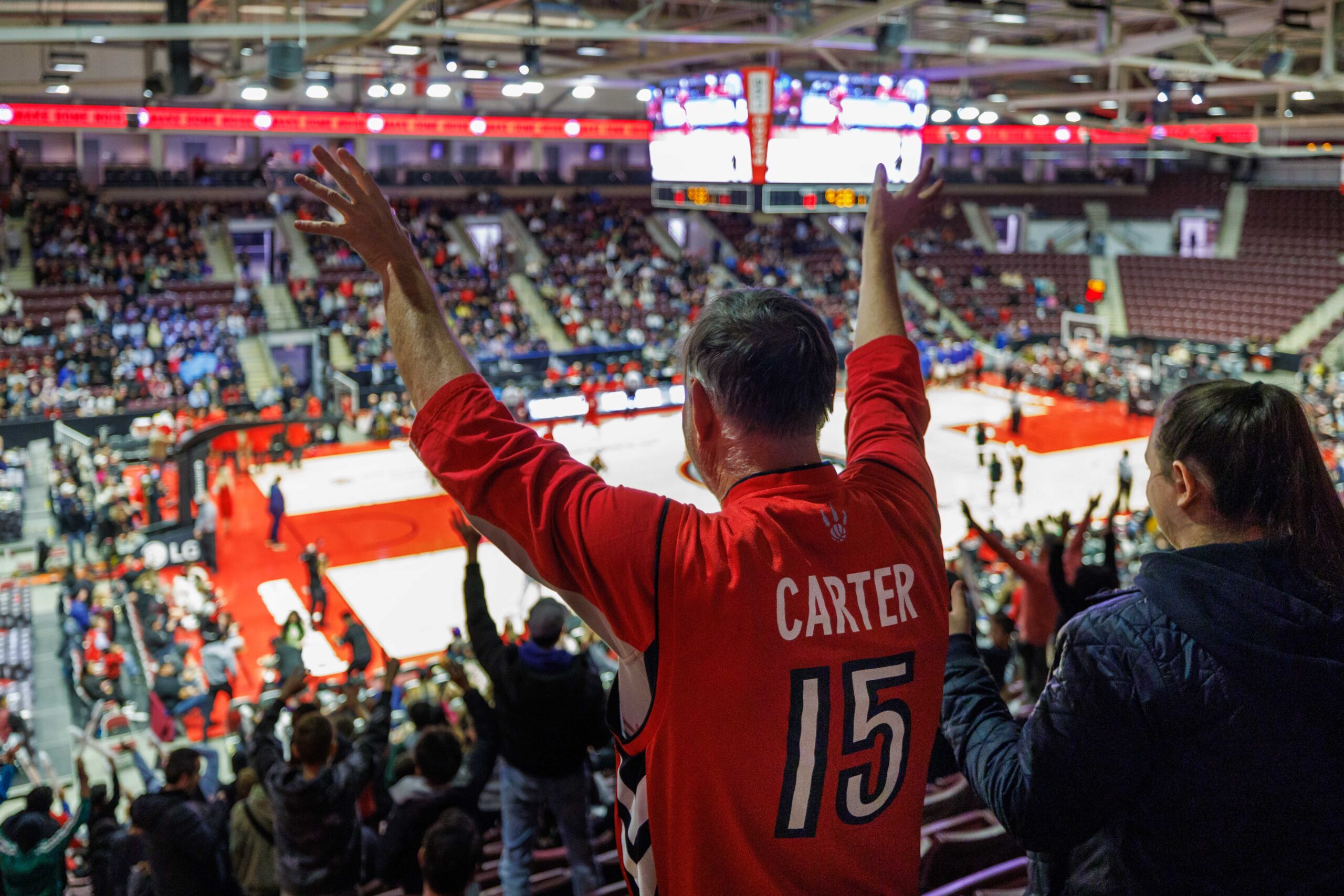 A person cheering in the crowd.